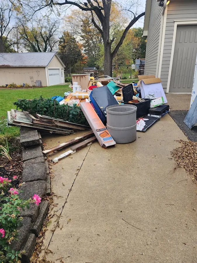 Dumpster being loaded with debris for 3 Yard Dumpster Rental in Zephyrhills North